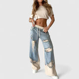Damskie Jeansy Oversize z Przetarciami i Elastycznym Pasem