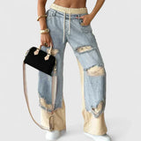 Damskie Jeansy Oversize z Przetarciami i Elastycznym Pasem